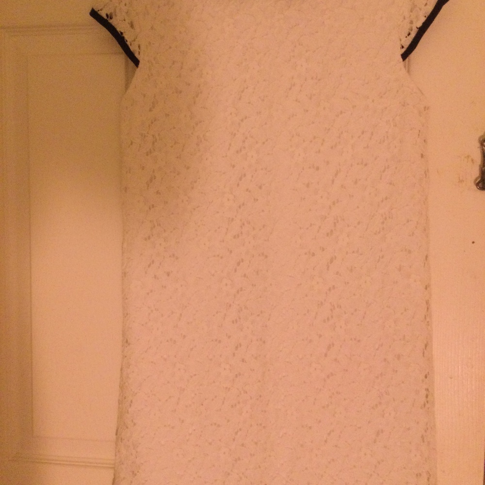 White lace mini dress with black collar, lining